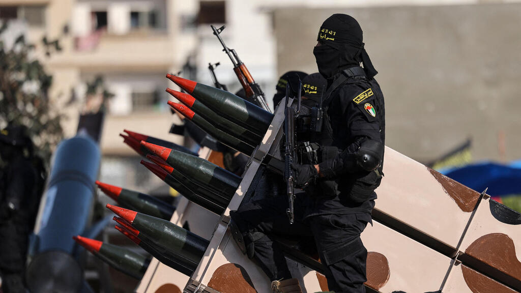 Боевики Исламского джихада (Фото: AFP) מצעד של הזרוע הצבאית של הג'יהאד האיסלאמי לרגל סיום המערכה בעזה