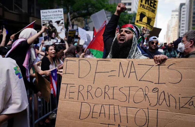 Pro-Palestinian supporters demonstrate near the Israeli Consulate following the flare-up of Israeli-Palestinian violence, in the Manhattan borough of New York City, New York, US, May 18, 2021.