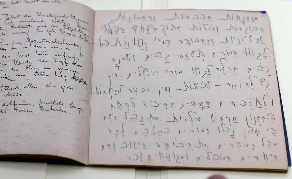 An original manuscript written in Hebrew (R) and German (L) by Jewish German-speaking novelist and story writer Franz Kafka 