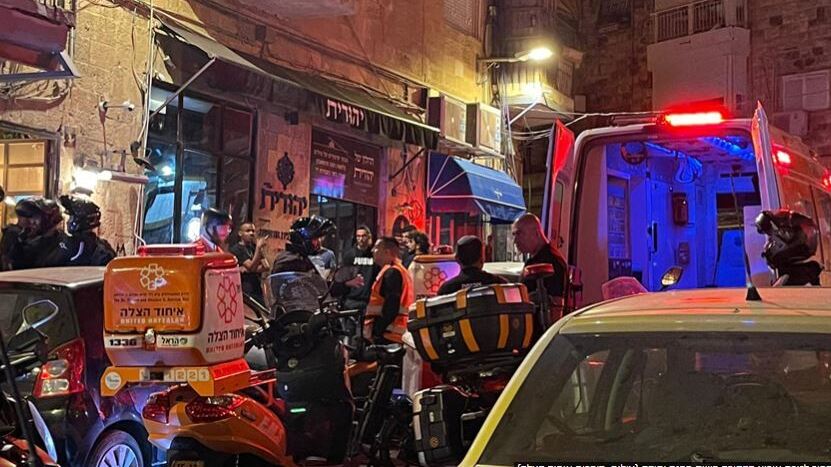United Hatzallah aiding an Arab man stabbed in Jerusalem's Mahne Yehuda Market