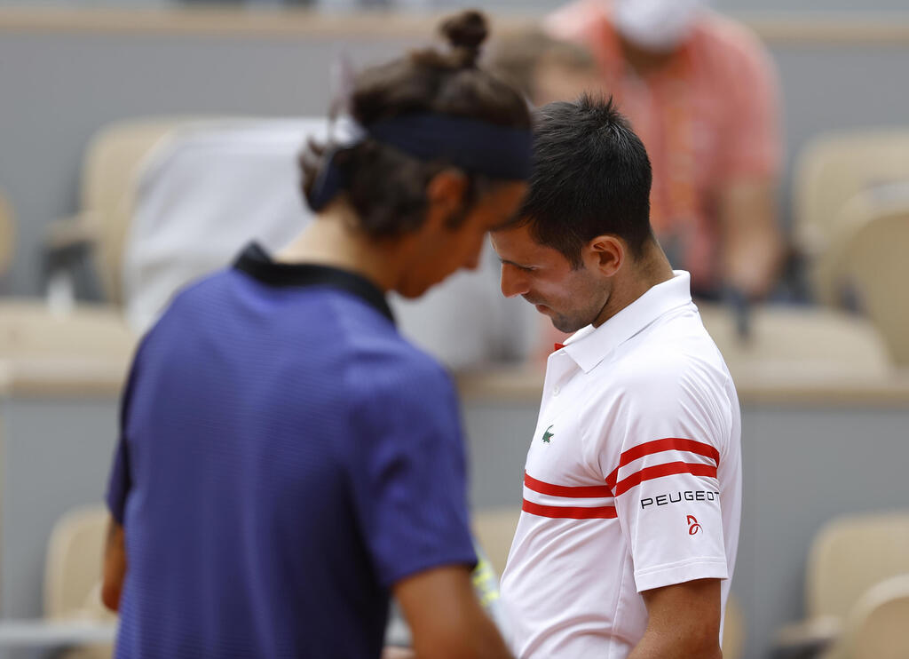 ראש בראש. ג'וקוביץ' ומזוטי בתמונה ששווה 1000 מילים