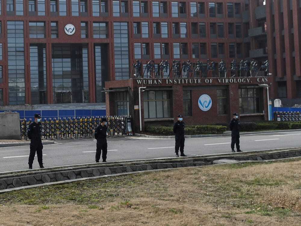 Chinese security men outside the Wuhan Institute of Virology