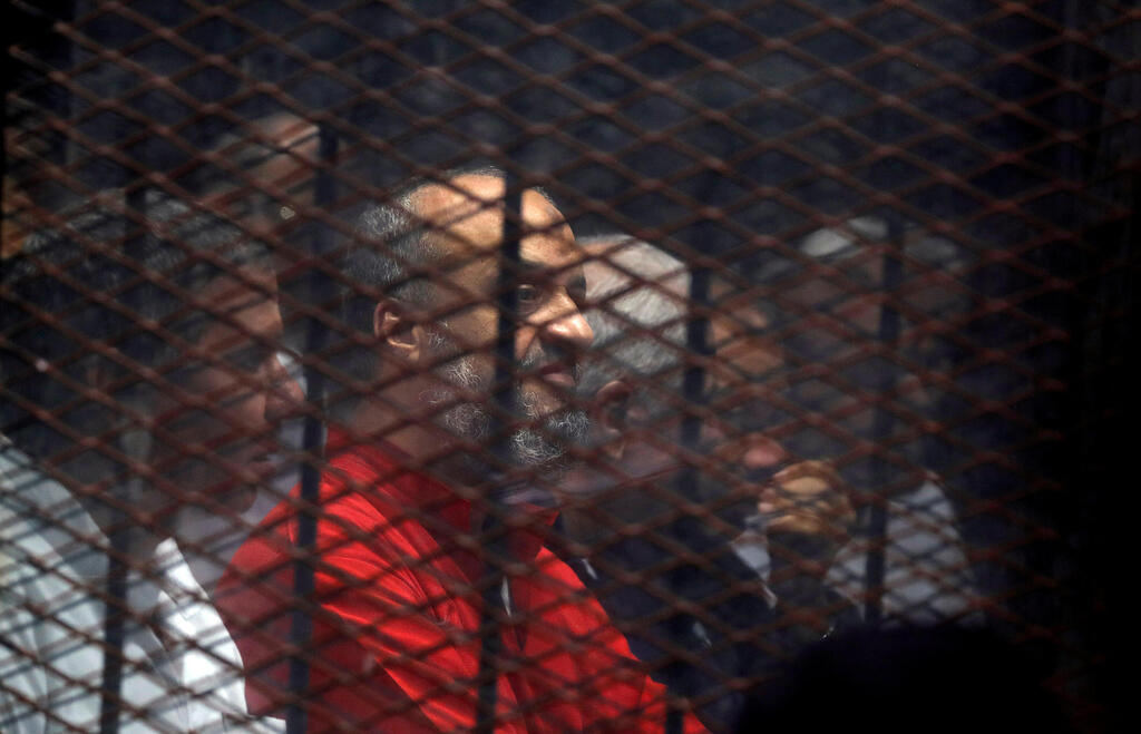 Muslim Brotherhood's senior member Mohamed El-Beltagi sits behind the bars during a court session in Cairo, Egypt, December 2, 2018 