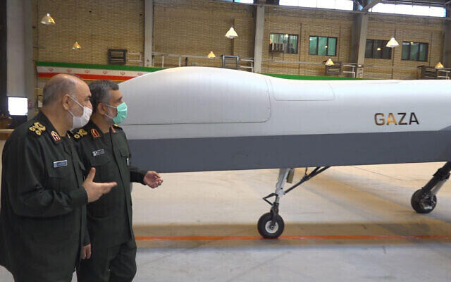  Iranian Revolutionary Guard Commander Gen. Hossein Salami, left, and the Guard's aerospace division commander Gen. Amir Ali Hajizadeh talk while unveiling a new drone called "Gaza" in an undisclosed location in Iran 