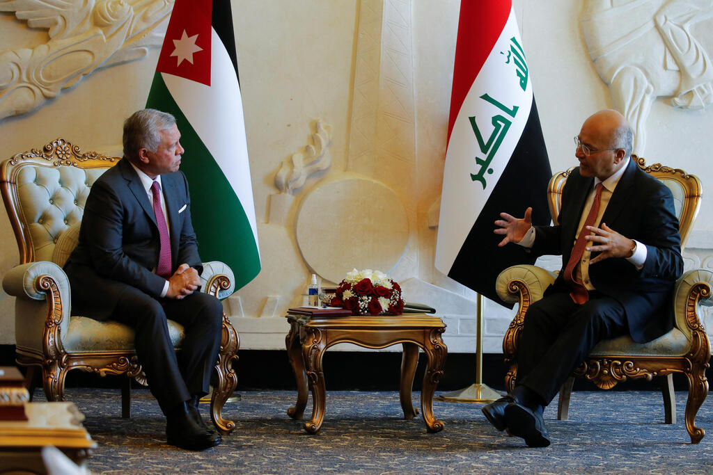 Iraqi President Barham Salih and King Abdullah II of Jordan talk at Baghdad International Airport 