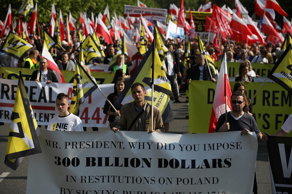 People take part in far right protest against the U.S. Senate's decision to accept a law that allows Jewish people to claim compensation for property lost during WW2 in Warsaw, Poland, May 11, 2019 