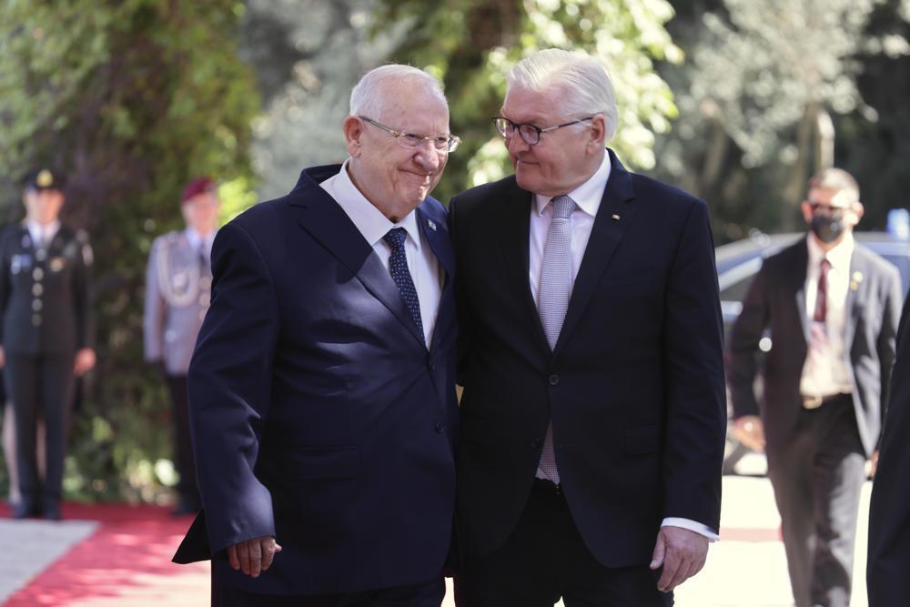 President Reuven Rivlin, left, walks with German President Frank-Walter Steinmeier at the president's residence in Jerusalem 