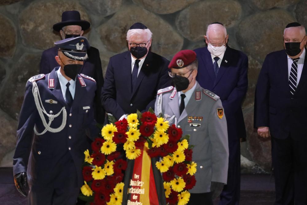 German President Frank-Walter Steinmeier, center, lays a wreath during a visit to the Hall of Remembrance at the Yad Vashem Holocaust memorial in Jerusalem 