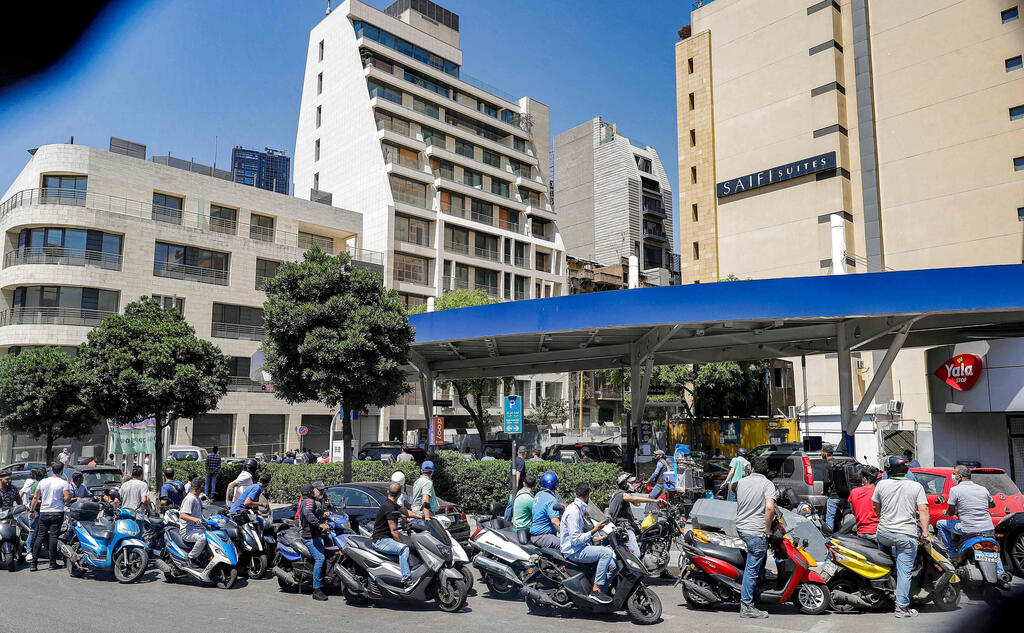 Dozens queue in front of a gas station amid a gas crisis in Lebanon 