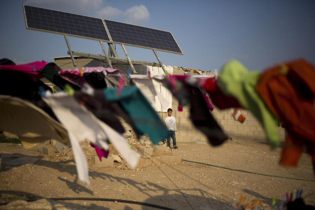 Solar panels provide electricity for residents of the Bedouin village Umm al Hiram in the Negev Desert 