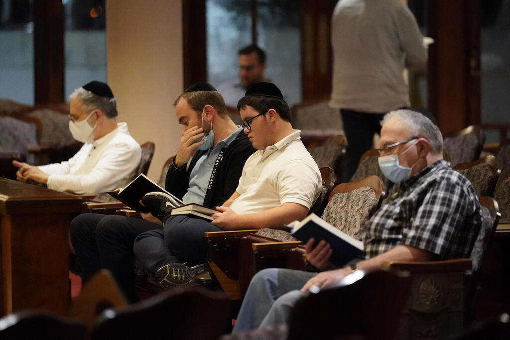 Jewish faithful pray at the Shul of Bal Harbour near the collapsed Champlain South Towers in Surfside, Florida 