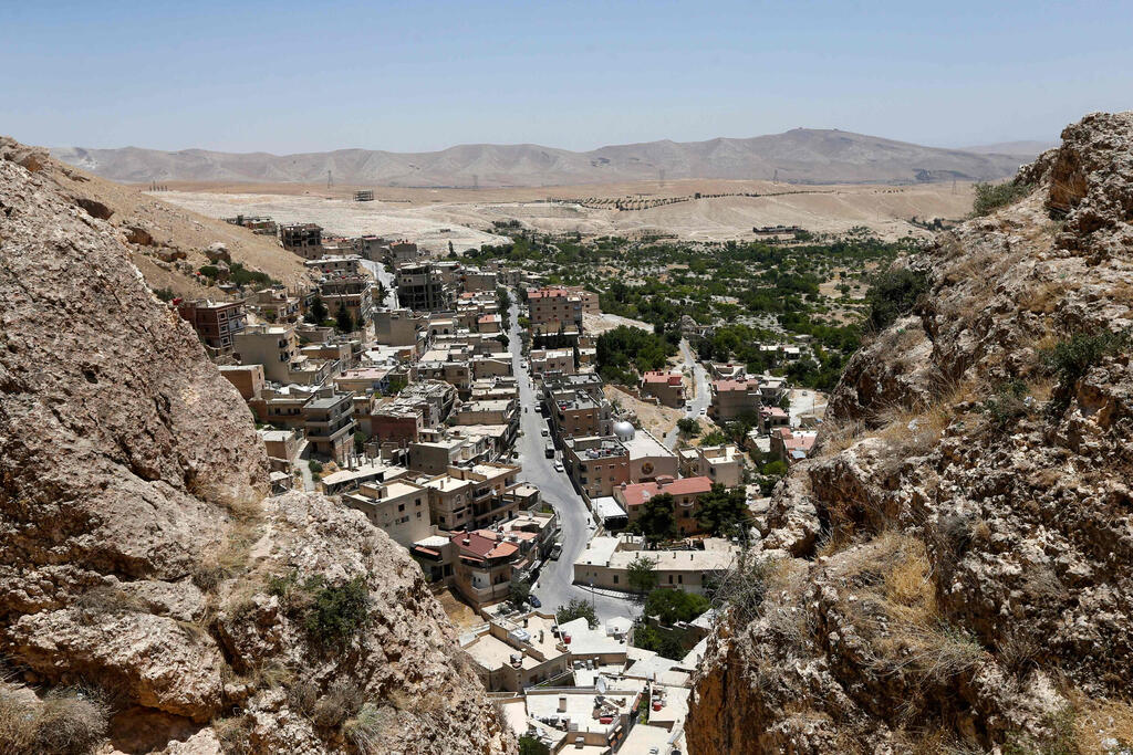 This picture shows a view taken from cliffs above the village of Maalula north of the Syrian capital Damascus 