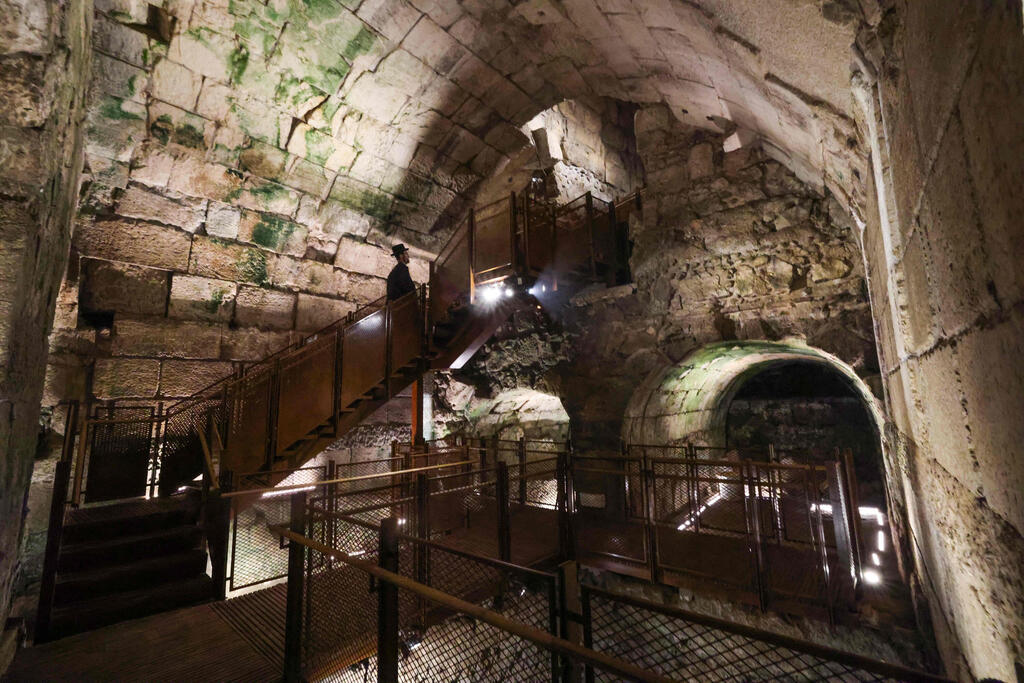 An ultra-Orthodox Jew looks at parts of a Second Temple period (516 BC-AD 70) public building considered to be one of the most luxurious found to date, as they are unveiled by the Israel Antiquities Authority in Jerusalem 