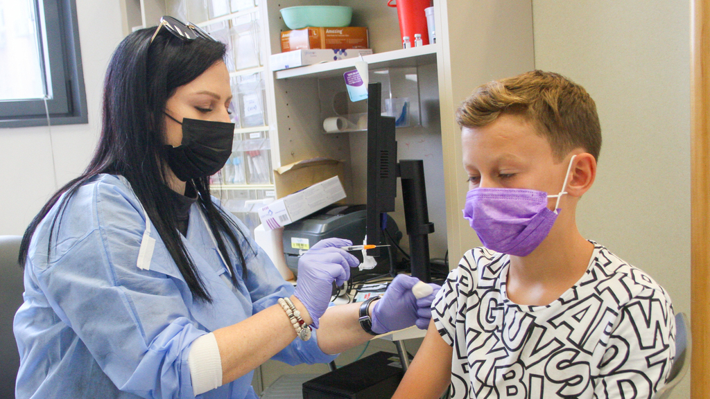 A 12-year-old boy receives his coronavirus vaccine in the coastal city of Netanya (Photo: Ido Erez) ילדים מתחסנים