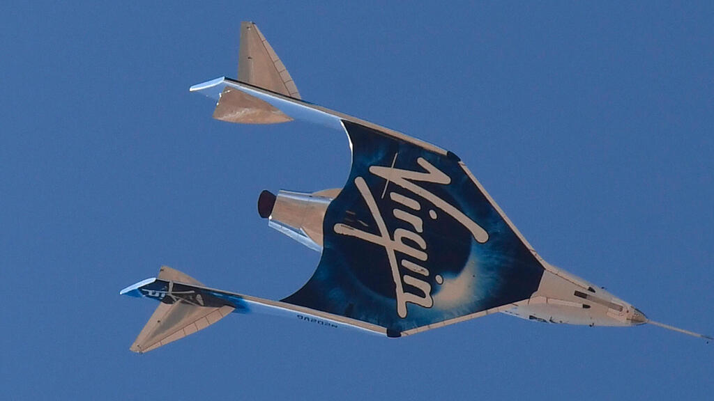 The Virgin Galactic SpaceShipTwo space plane Unity and mothership separate flying way above Spaceport America, near Truth and Consequences, New Mexico on July 11, 2021