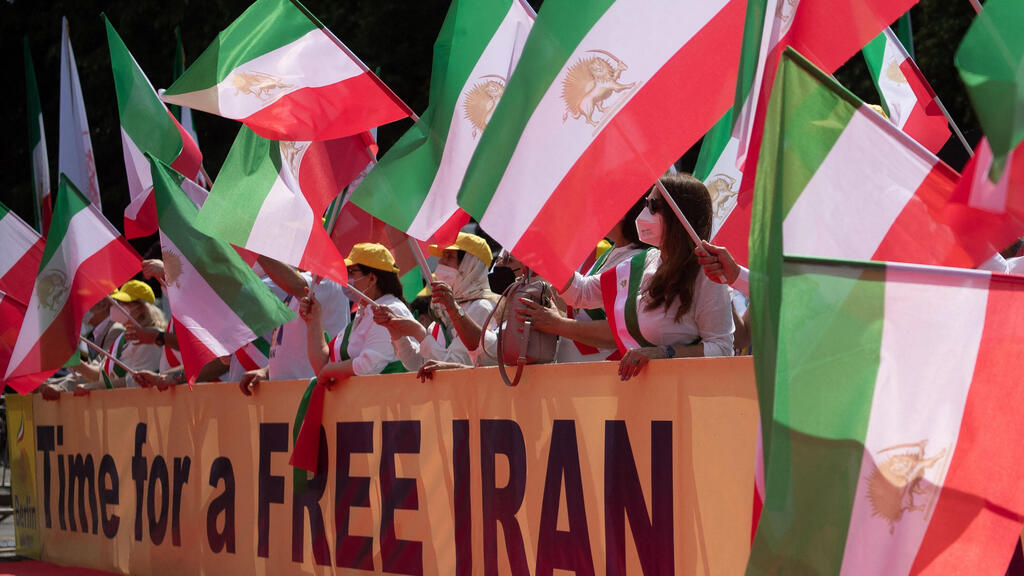 emonstrators take part in a protest called by the National Council of Resistance of Iran (NCRI) against the Iranian regime in front of the Brandenburg Gate in Berlin on July 10, 2021.