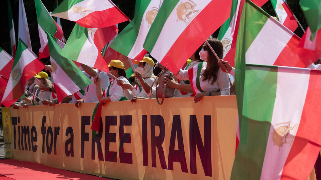 emonstrators take part in a protest called by the National Council of Resistance of Iran (NCRI) against the Iranian regime in front of the Brandenburg Gate in Berlin on July 10, 2021.