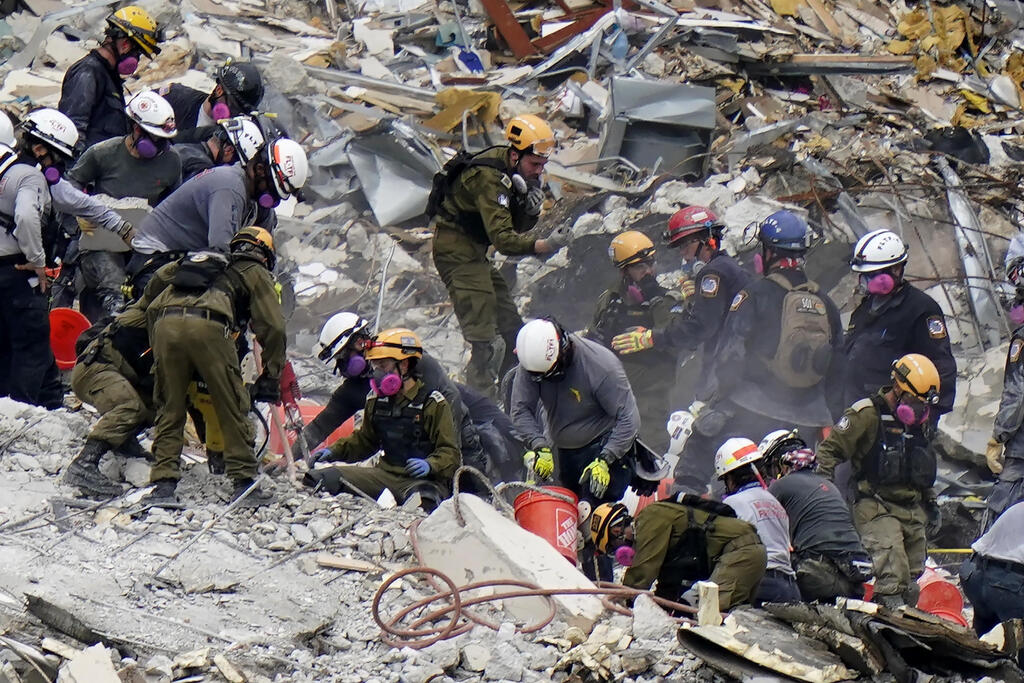 Crews from the United States and Israel work in the rubble Champlain Towers South condo, Tuesday, June 29, 2021, in Surfside, Fla (Photo: AP) Crews from the United States and Israel work in the rubble Champlain Towers South condo, Tuesday, June 29, 2021, in Surfside, Fla