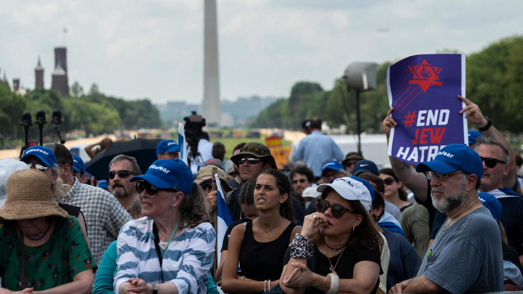 People look during a rally on "No Fear: a Rally in Solidarity With the Jewish People" on the National Mall in Washington, DC on July 11, 2021