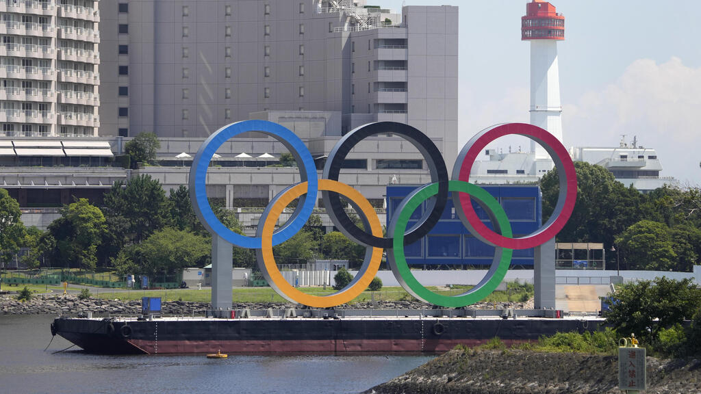 The Olympic rings float on a barge ahead of the 2020 Summer Olympics, Monday, July 19, 2021, in Tokyo