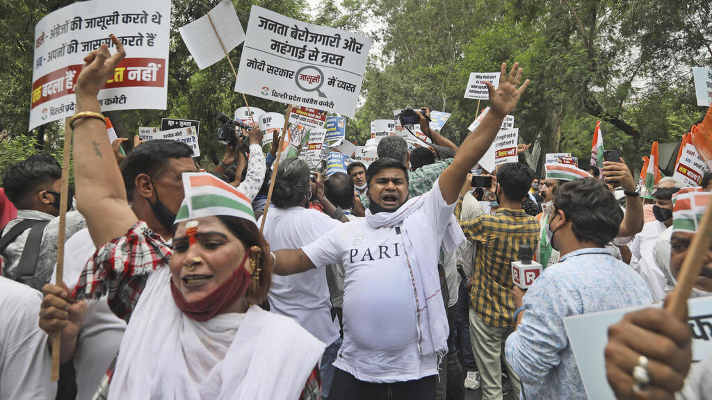 Congress party workers shout slogans during a protest accusing Prime Minister Narendra ModiגÄôs government of using military-grade malware from Israel-based NSO Group to spy on political opponents 