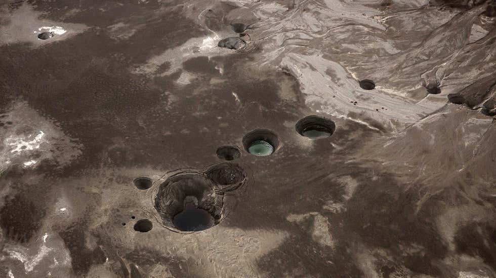 An aerial photo shows sinkholes created by the drying of the Dead Sea, near Kibbutz Ein Gedi 