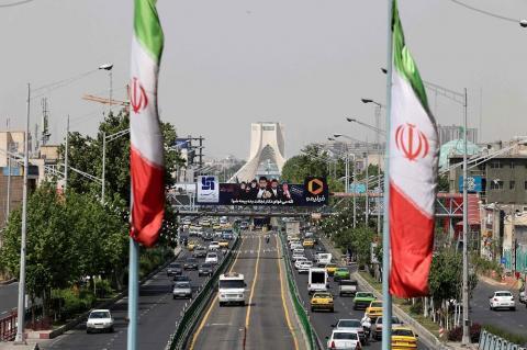 A view shows traffic on Azadi street in Iran's capital Tehran on April 20, 2021