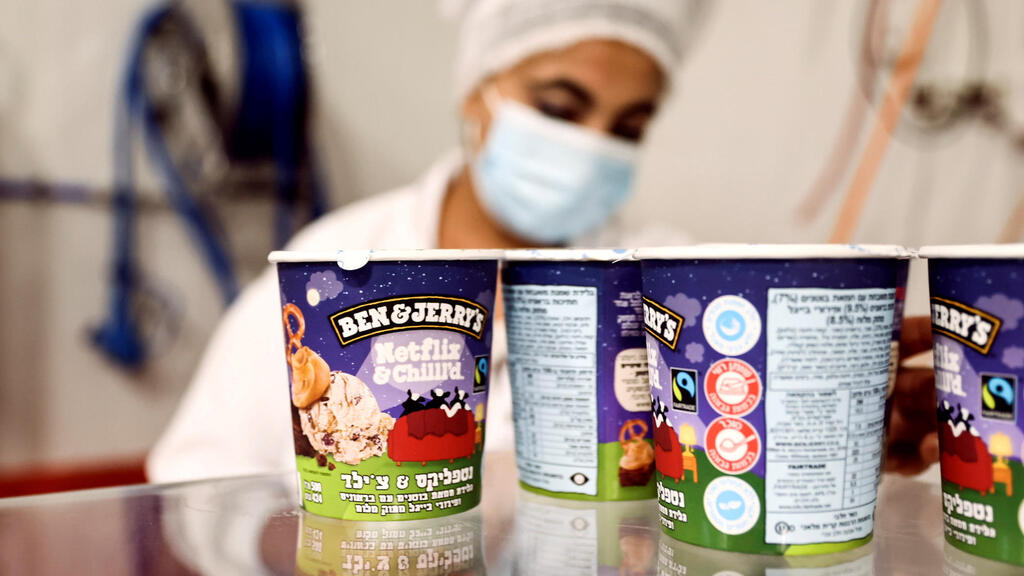 Tubs of ice-cream are seen as a labourer works at Ben & Jerry's factory in Be'er Tuvia, Israel July 20, 2021