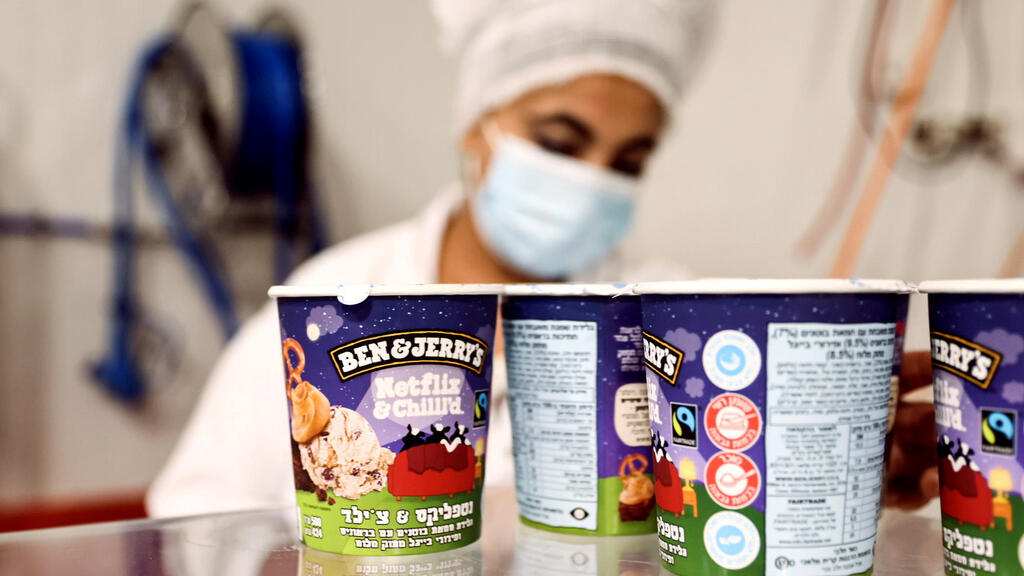 Tubs of ice-cream are seen as a labourer works at Ben & Jerry's factory in Be'er Tuvia, Israel July 20, 2021