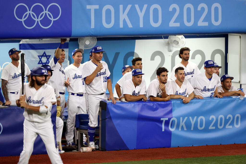 Team Israel looks on from the dugout in the bottom of the ninth inning against Team United States during the baseball opening round Group B game on day seven of the Tokyo 2020 Olympics