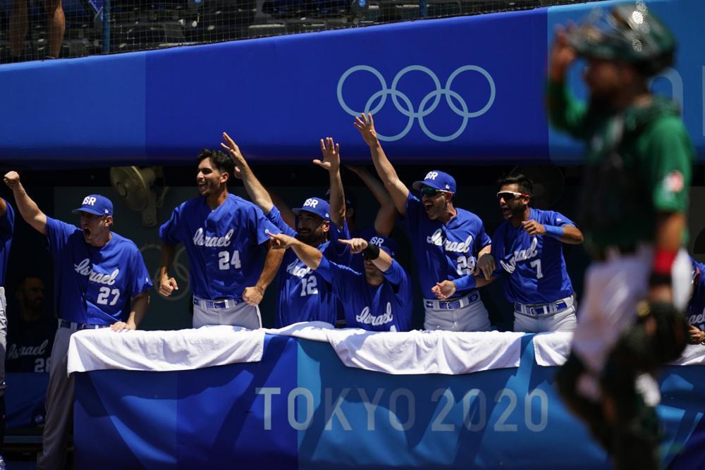 Israel players react after Danny Valencia hit a three-run home run by during a baseball game against Mexico 