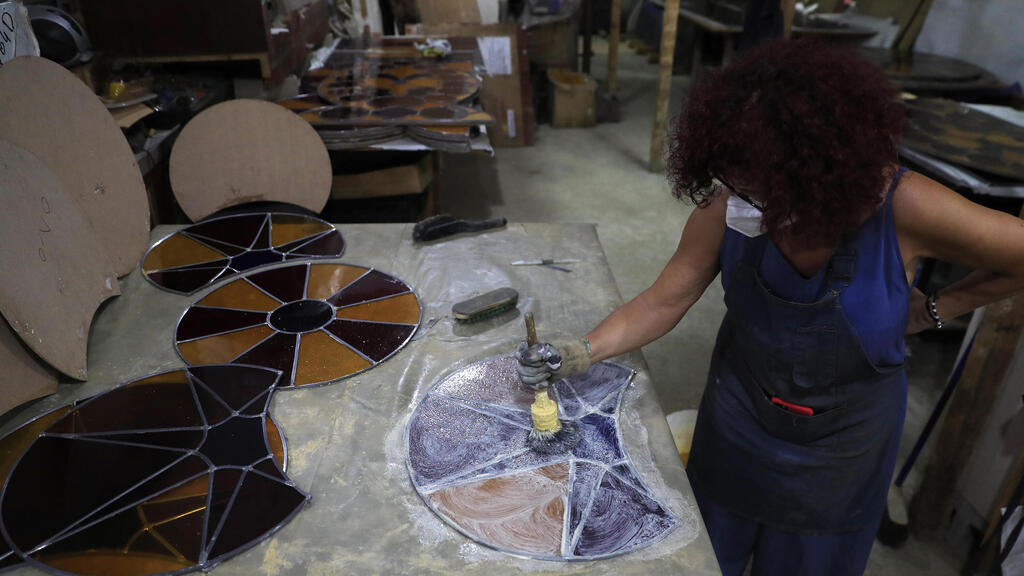 Artist Maya Hussaini works to recreate one of the stained-glass windows that were the trademark of BeirutגÄôs Sursock Museum, shattered in last yearגÄôs port explosion, at her studio in Beirut