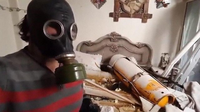 A man showing an alleged chemical  armament used at the bombardment of Douma