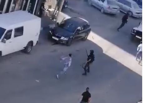 Members of the Jabari clan shooting in the streets of Hebron, in July 