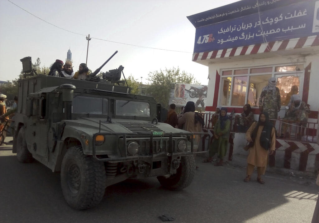Taliban fighters after taking control of Kunduz city in Afghanistan on Monday 