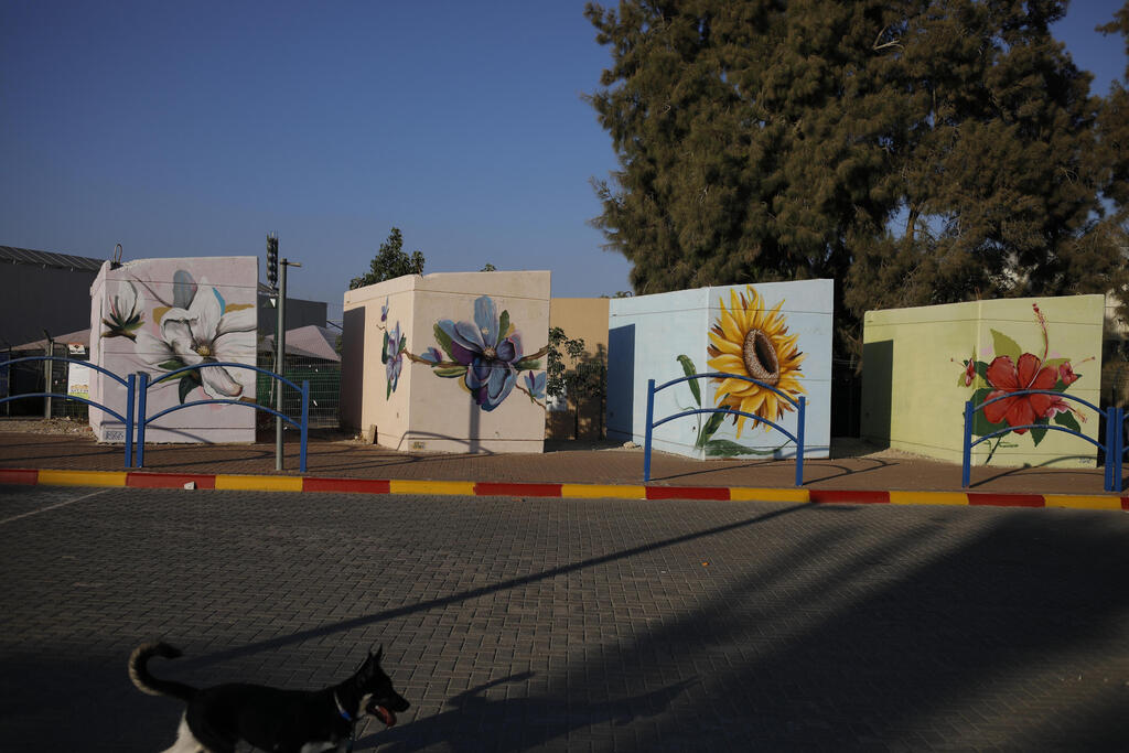 Small concrete bomb shelters painted in bright colors for children waiting for their school bus, in Sderot, Israel, July 28, 2021