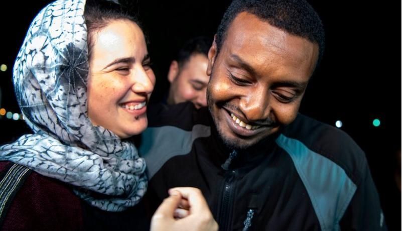 Moroccan journalist Hajar Raissouni is greeted by her boyfriend Rifaat Al Amine upon leaving prison after being granted a royal pardon in 2019 