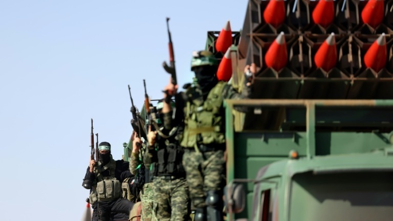 Hamas militants display their rocket arsenal during a parade in the Gaza Strip shortly after a ceasefire ended 11 days of deadly conflict with Israel 