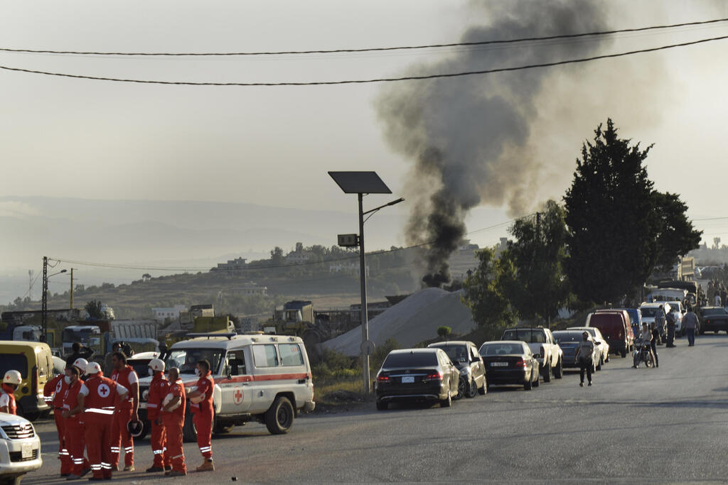 Smoke rises from the site of a fuel truck explosion in northern Lebanon on Sunday 