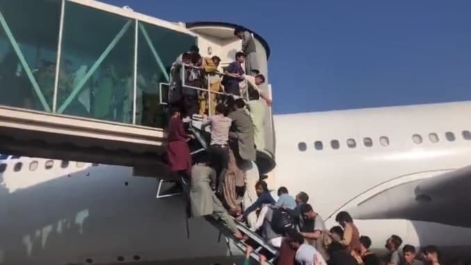  Afghans attempt to board planes to escape the country on Monday 