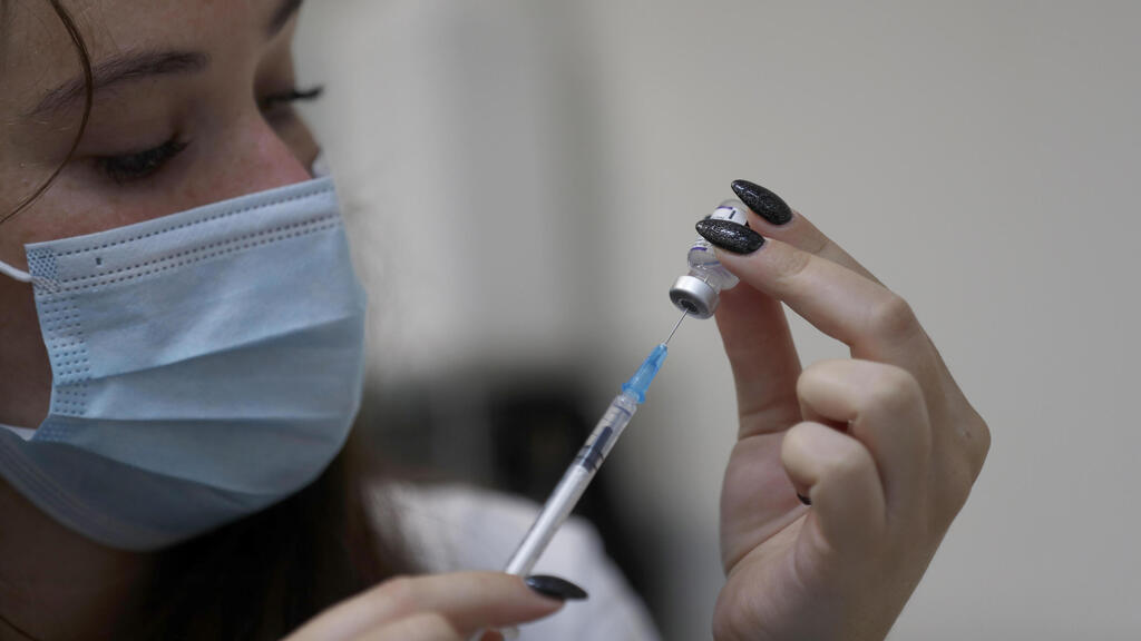 A nurse prepares to administer the 3rd dose of the coronavirus vaccine in Jerusalem last week 