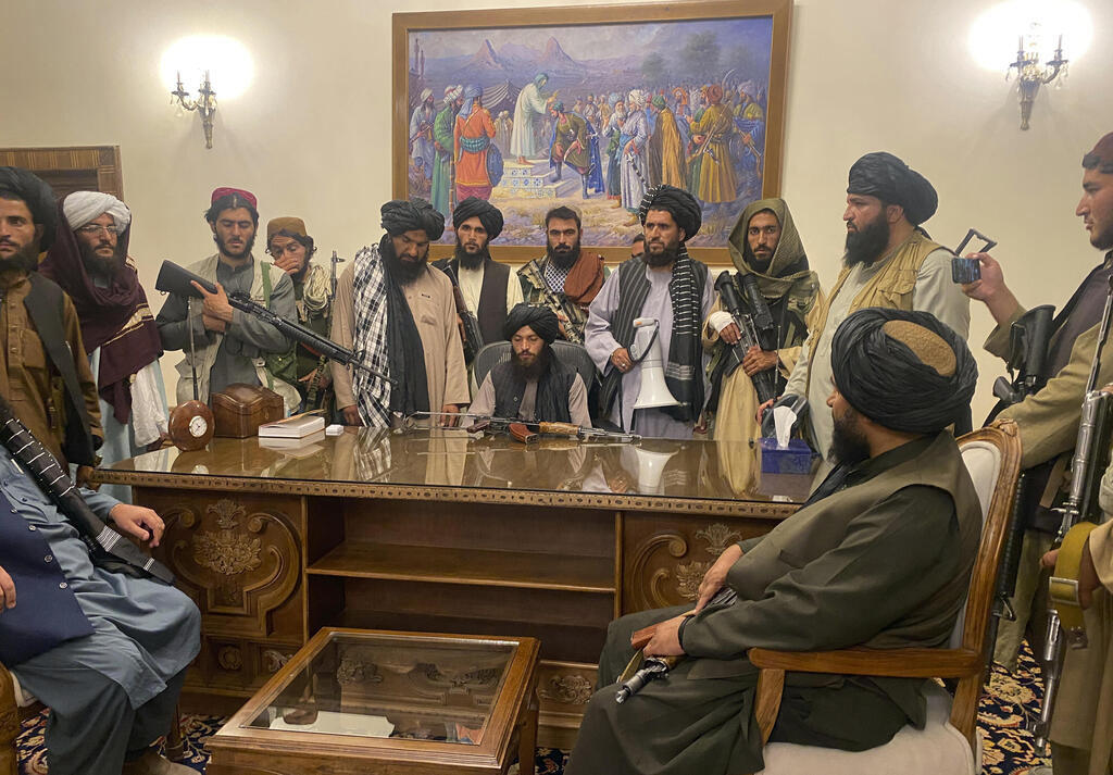 Taliban fighters after taking control of the Presidential Palace in Kabul last week 