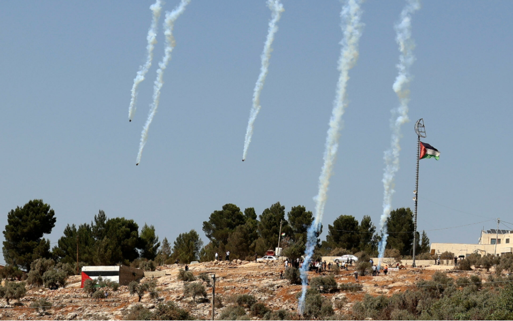 Israeli forces fire tear gas as Palestinians in Beita protest against the Eviatar outpost on August 20, 2021