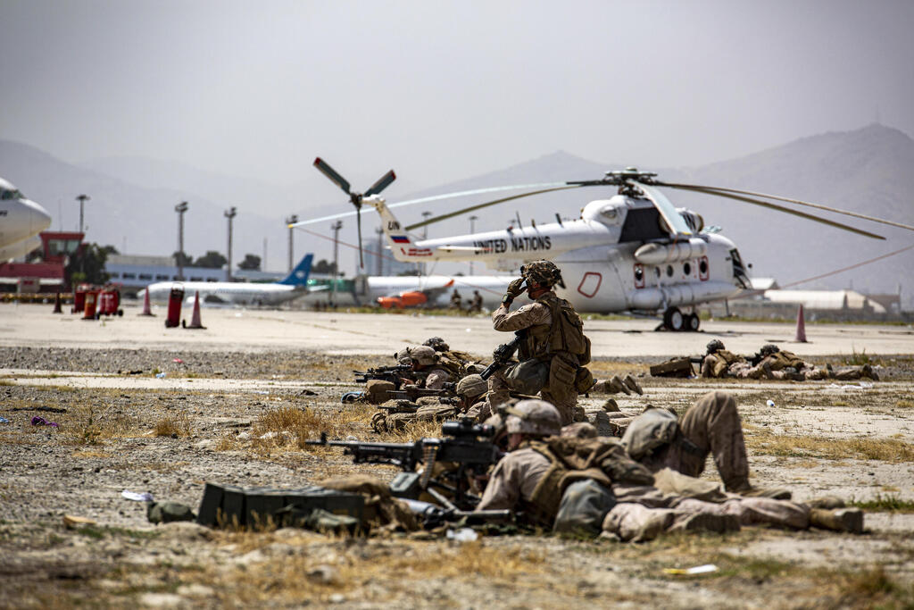 Marines provide security at Hamid Karzai International Airport in Kabul 