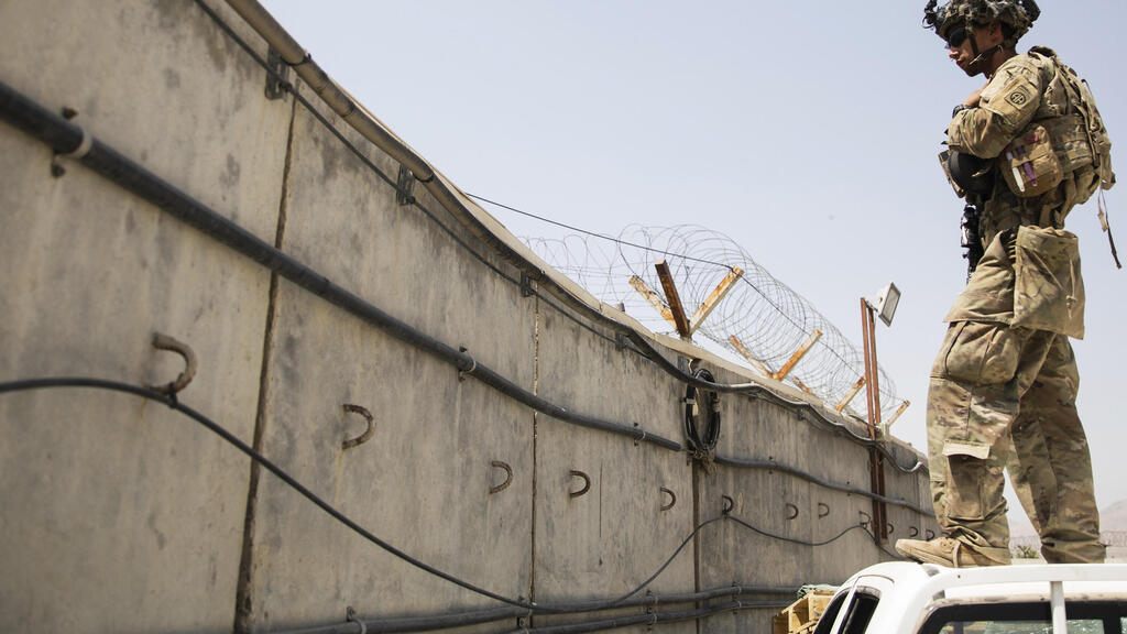 Paratrooper assigned to B Company, 2nd Battalion, 501st Parachute, Infantry Regiment, 1st Brigade Combat Team, 82nd Airborne Division conducts security at Hamid Karzai International Airport in Kabul (Photo: AP) In this image provided by the U.S. Army, a paratrooper assigned to B Company, 2nd Battalion, 501st Parachute, Infantry Regiment, 1st Brigade Combat Team, 82nd Airborne Division conducts security at Hamid Karzai International Airport in Kabul