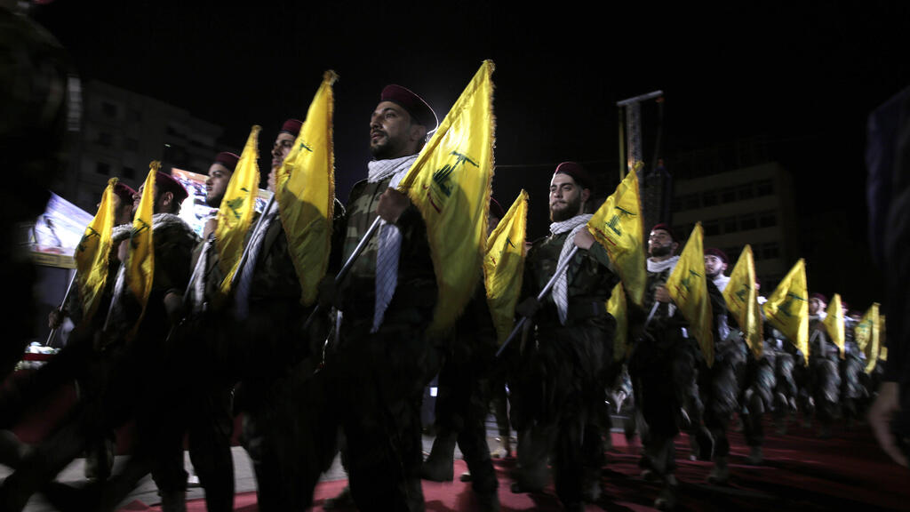  2019 file photo, Hezbollah fighters march at a rally to mark Jerusalem day, in the southern Beirut suburb of Dahiyeh, Lebanon