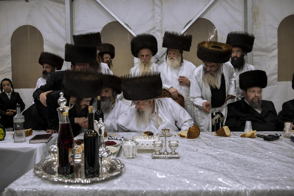 Tabersky, left, blessed by the chief rabbi of the Lelov Hassidic dynasty Aharon Biderman during the pidyon haben ceremony for his son Yossef, in Beit Shemesh, Israel, Thursday, Sept. 16, 2021