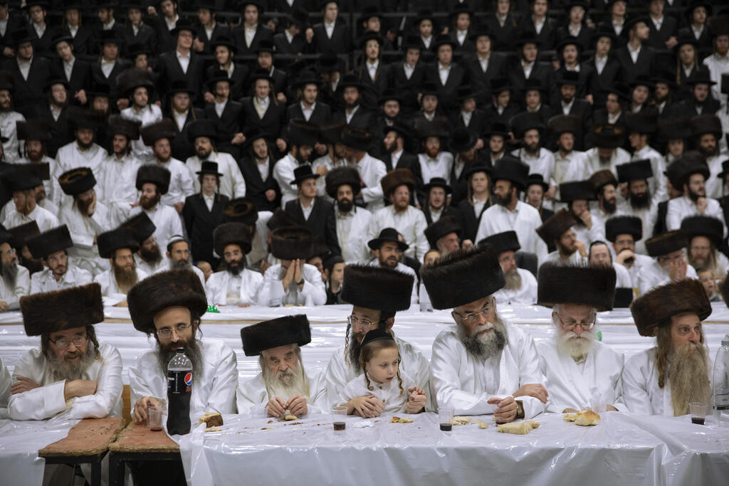 Members of the Lelov Hassidic dynasty attend the pidyon haben ceremony of the great grandchild of their chief rabbi Aharon Biderman in Beit Shemesh, Israel, Thursday, Sept. 16, 2021