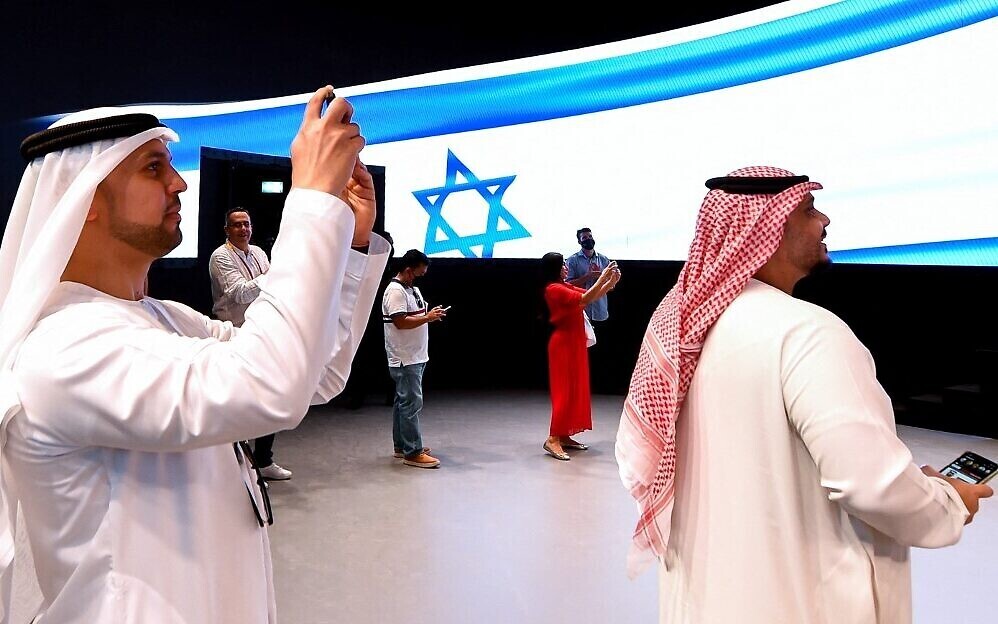 People take pictures in the Israel pavilion during a media tour ahead of the opening of the Dubai Expo 2020 in the Gulf Emirate 