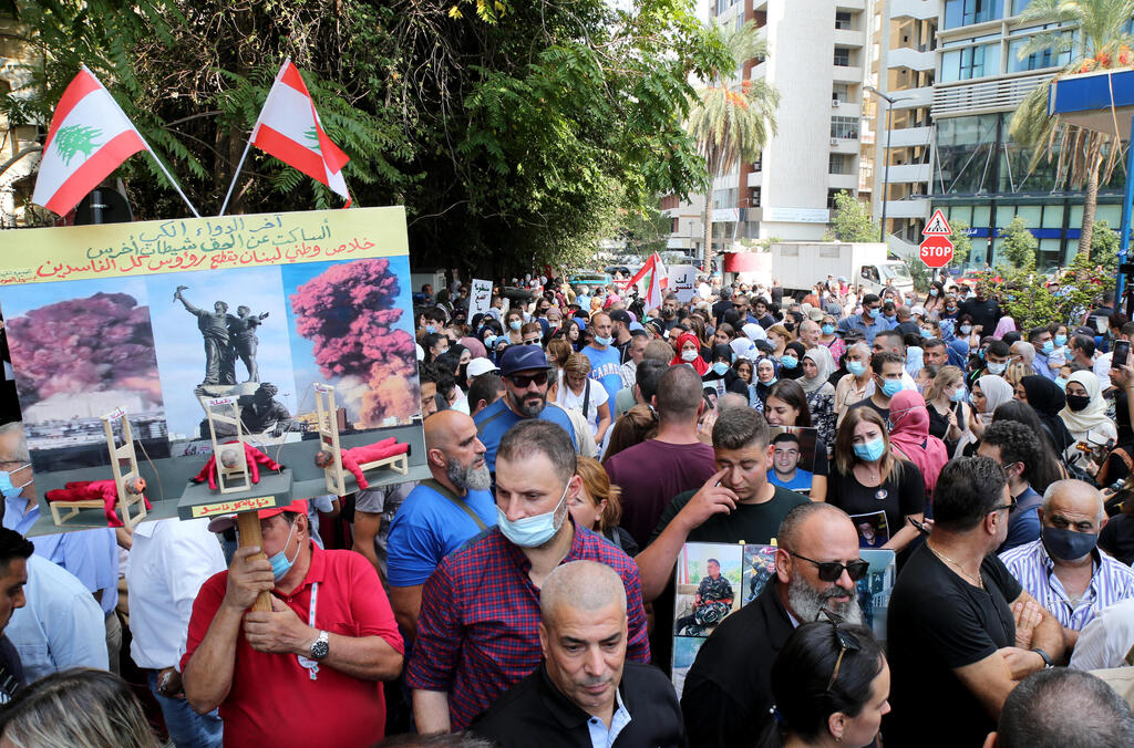 Anti-government activists and families of Beirut Blast victims take part in a protest, in front the Justice Palace in Beirut, Lebanon, 29 September 2021